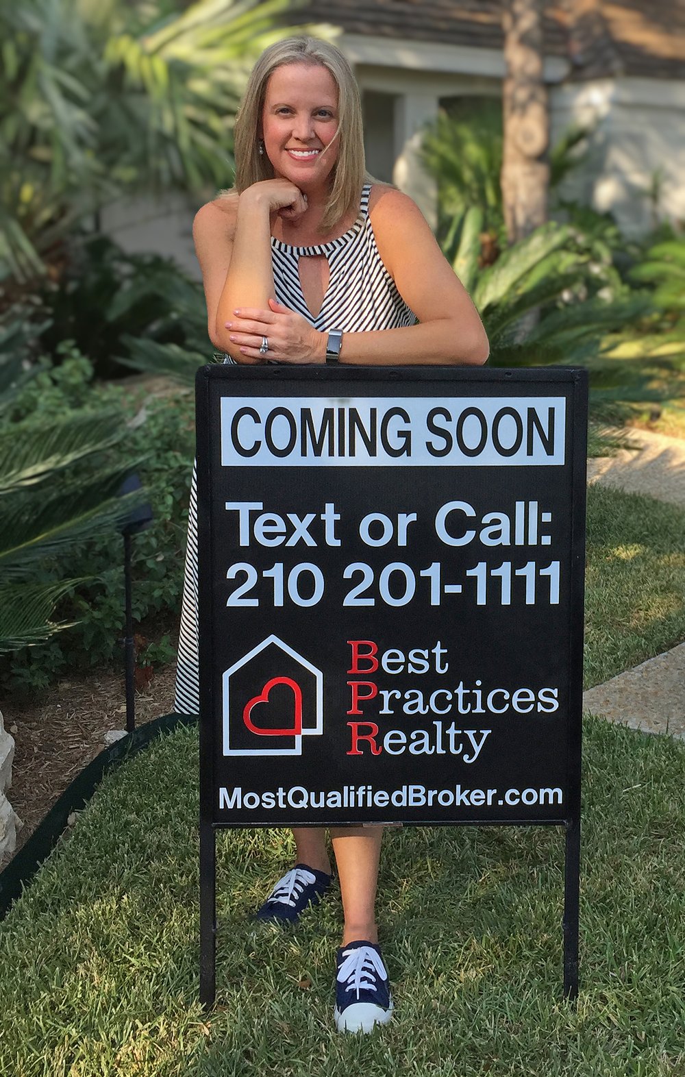 Leah McNamara of Best Practices Realty beside a Coming Soon yard sign